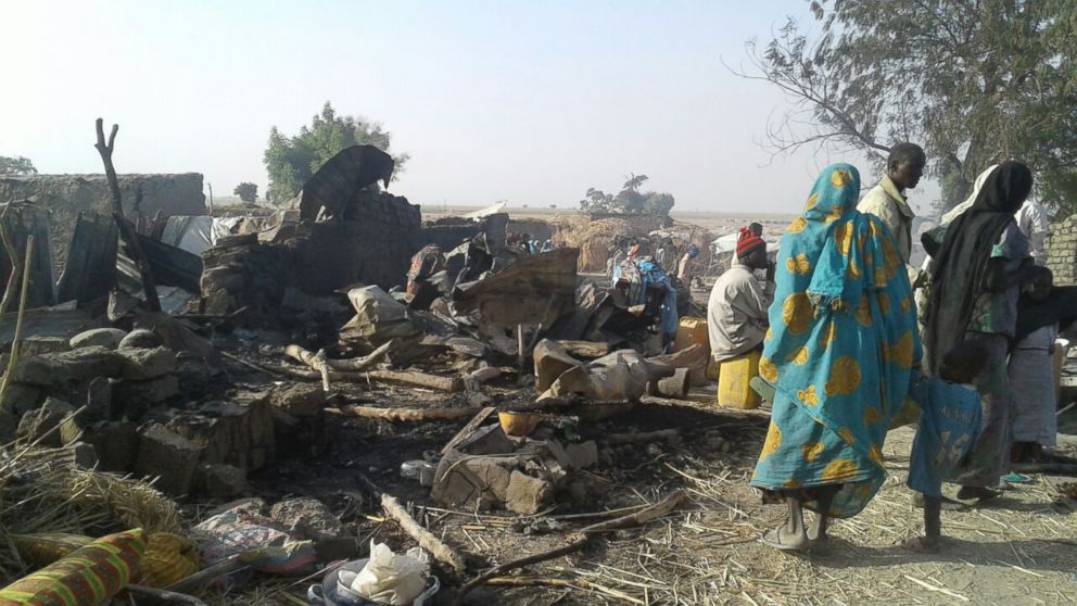 PHOTO: An image released by Doctors Without Borders shows people walking at the site of an accidental military airstrike at an internally displaced persons camp in Rann, Nigeria, Jan. 17, 2017.