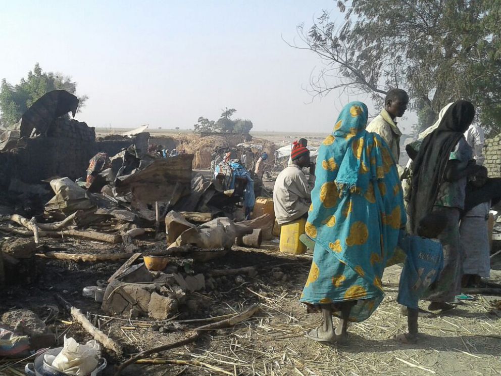 PHOTO: An image released by Doctors Without Borders shows people walking at the site of an accidental military airstrike at an internally displaced persons camp in Rann, Nigeria, Jan. 17, 2017.
