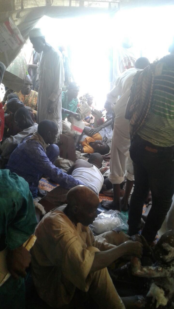 PHOTO: An image released by Doctors Without Borders shows injured people being comforted while waiting for treatment at the site of an accidental military airstrike at an internally displaced persons camp in Rann, Nigeria, Jan. 17, 2017.