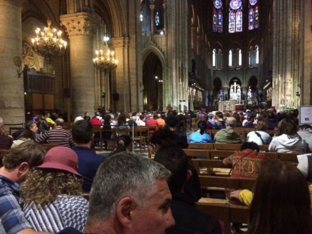 PHOTO: Visitors wait inside of Notre-Dame Cathedral during the incident, June 6, 2017. 