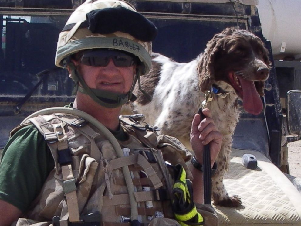 PHOTO: Flight Sergeant Will Barrow from the UK's RAF Police announces the death of his retired Arms and Explosive Search Dog, Buster. 