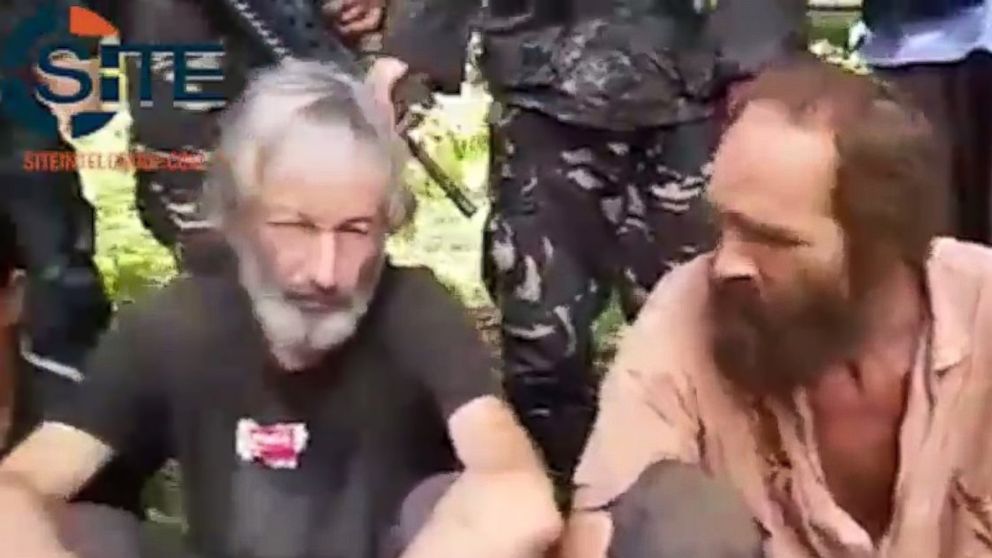 Canadian Robert Hall, left, and Norwegian Kjartan Sekkingstad, right, are shown in a video released by the Philippine-based extremist group Abu Sayyaf, May 3, 2016.
