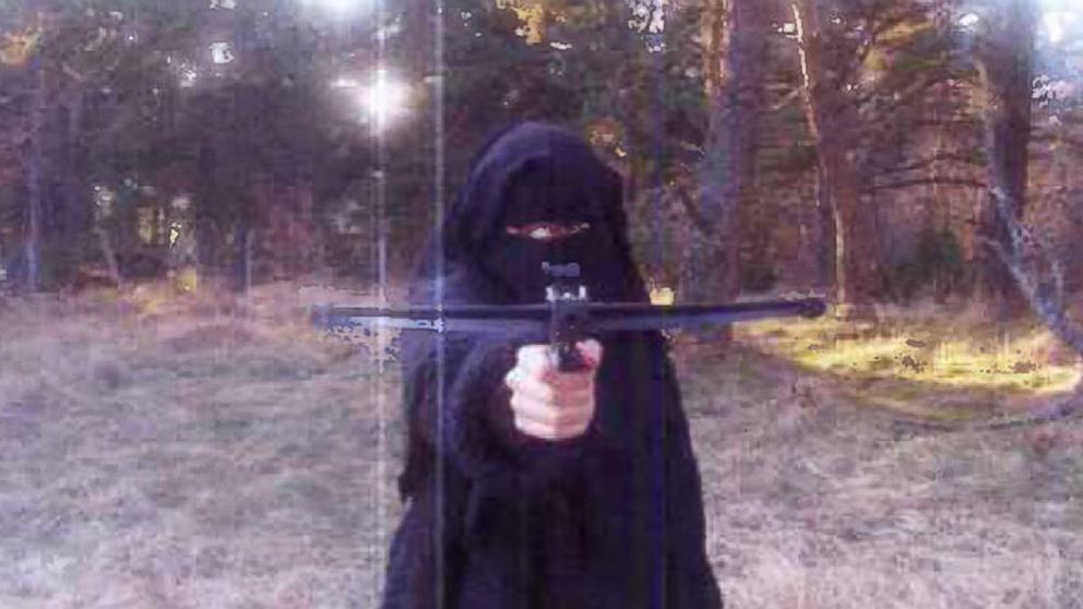 In this 2010 file photo, Hayat Boumeddiene trains with an arrow gun in the Grenoble area of France, who is wanted in connection with the shooting of a French policewoman and for being involved in the hostage situation.