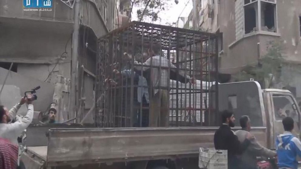 Still image from a video posted on November 1, 2015 showing caged civilians in Eastern Ghouta, Syria. 
