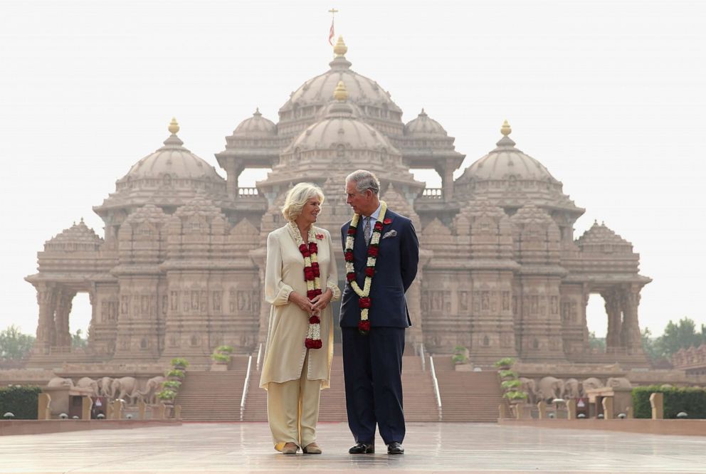 PHOTO: Camilla, Duchess of Cornwall and Prince Charles, Prince of Wales pose outside the Akshardham Temple during a visit to India on Nov. 8, 2013 in Delhi, India. 