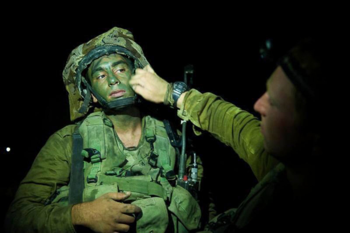 PHOTO: This photo was tweeted by the Israeli Defense Forces on July 17, 2014 with the caption, "From the Field: Our soldiers preparing to enter Gaza. The whole nation stands behind them."