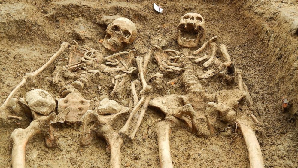 PHOTO: The man and woman were buried together in the same grave with their arms crossed together. Eleven skeletons have been uncovered so far, but the archaeologists believe there may be more. 