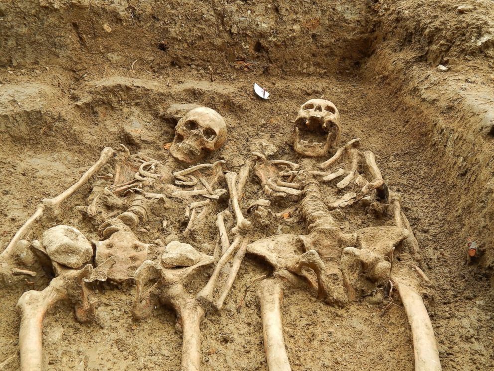 PHOTO: The man and woman were buried together in the same grave with their arms crossed together. Eleven skeletons have been uncovered so far, but the archaeologists believe there may be more. 