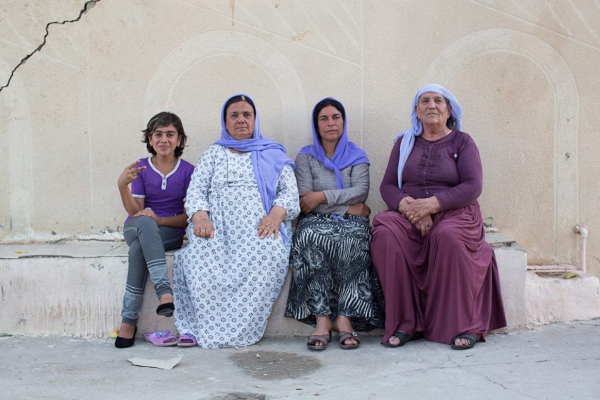 PHOTO: "We told her to sit with us so we could share her sadness." Dohuk, Iraq.