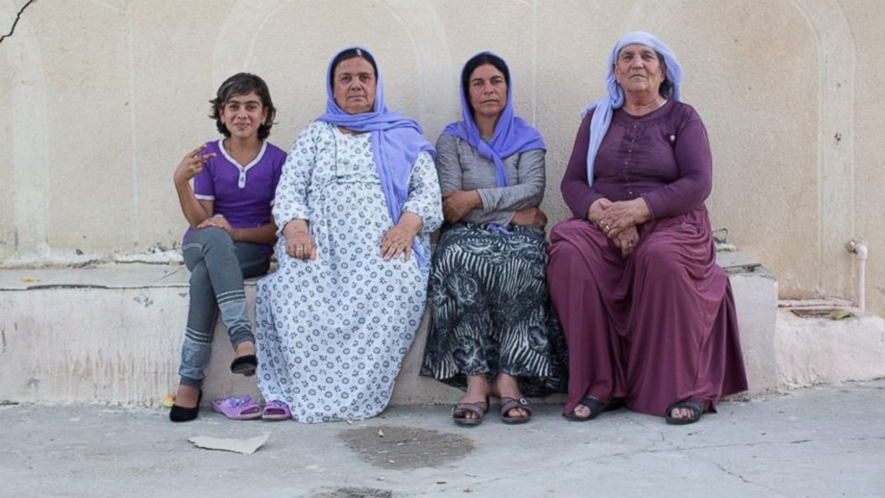PHOTO: "We told her to sit with us so we could share her sadness." Dohuk, Iraq.