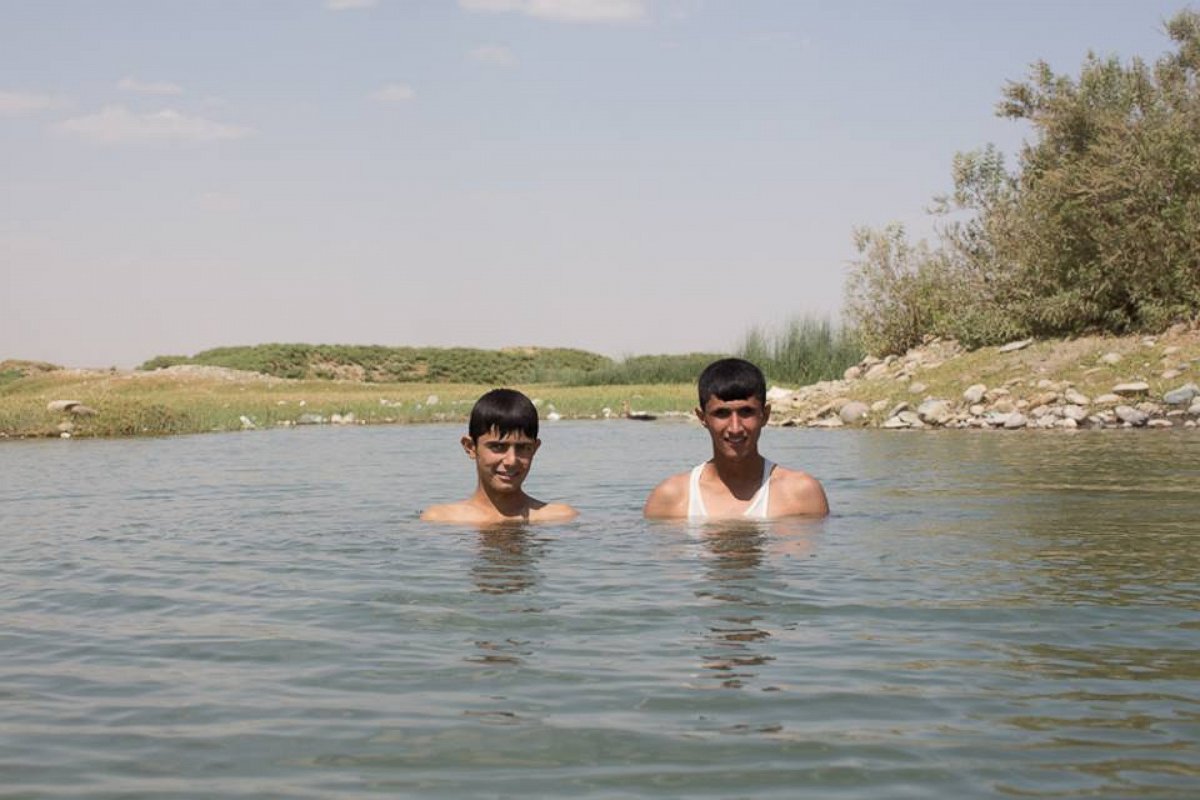 "Swimming is the greatest thing in life. If we have time, we swim ten times per day." Kalak, Iraq.