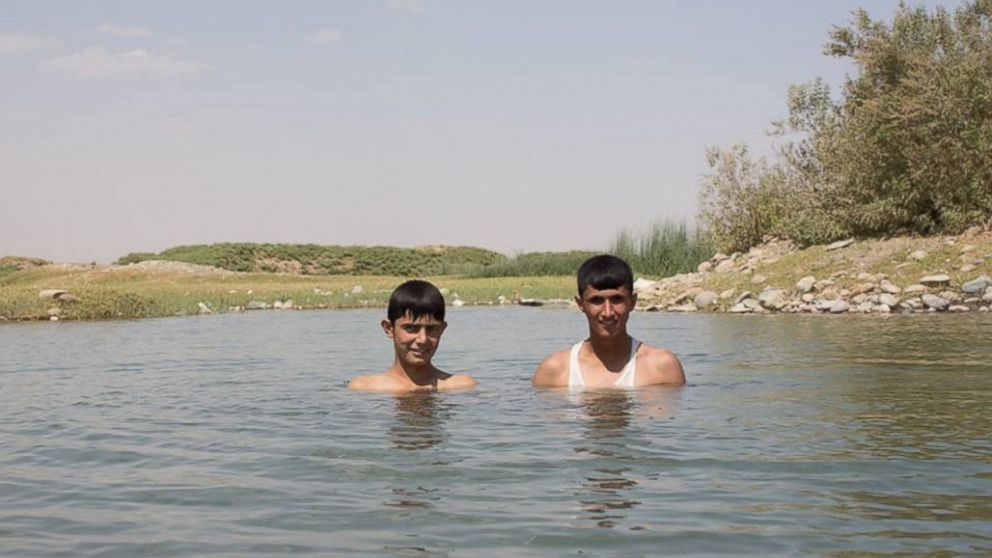 "Swimming is the greatest thing in life. If we have time, we swim ten times per day." Kalak, Iraq.