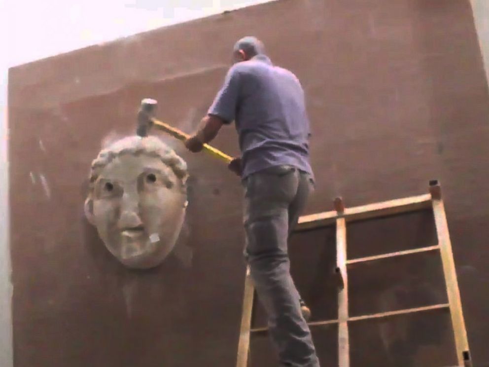 PHOTO: In a video released by the terror group ISIS in February 2015, militants purportedly destroy artifacts in a museum in Mosul, Iraq.