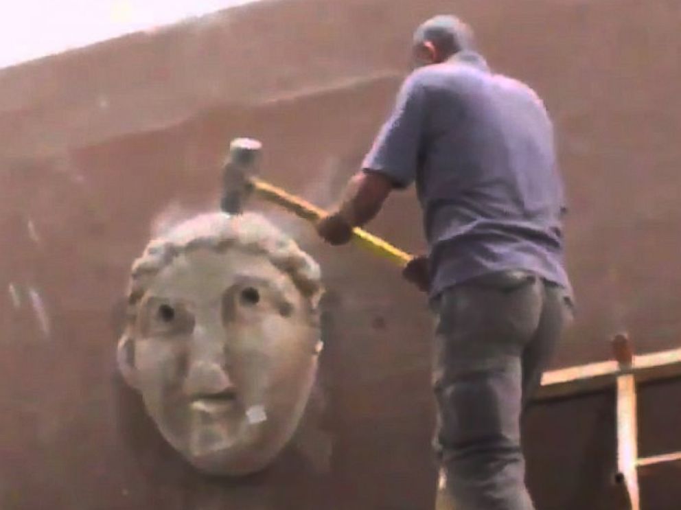 PHOTO: In a video released by the terror group ISIS in February 2015, militants purportedly destroy artifacts in a museum in Mosul, Iraq.