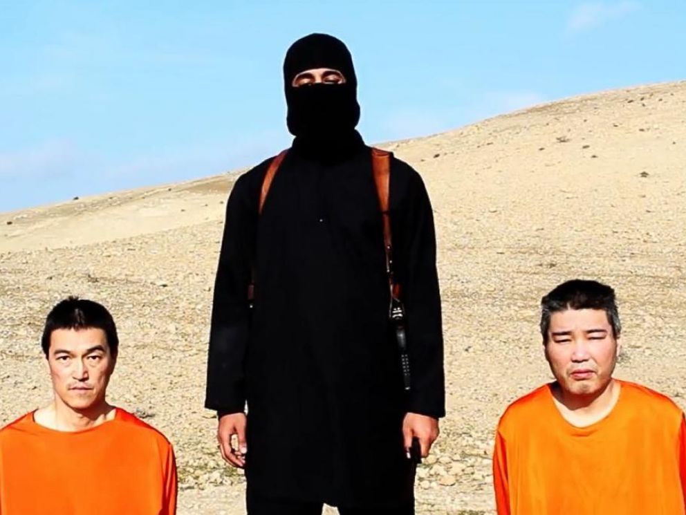 PHOTO: Japanese citizens Kenji Goto Jogo, left, and Haruna Yakawa, right, appear with the man dubbed Jihadi John, center, in a video released by ISIS on Jan. 19, 2015.