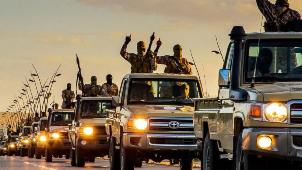 ISIS militants parade through Sirte, Libya in photos released by the Islamic State on Feb. 18, 2015.