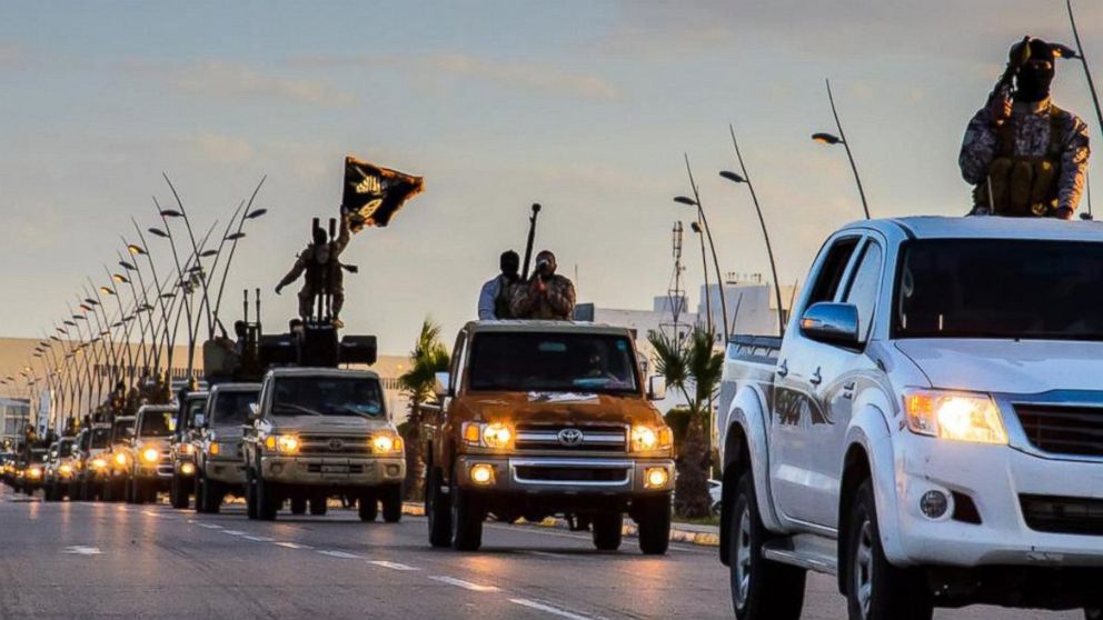 PHOTO: ISIS militants parade through Sirte, Libya in photos released by the Islamic State on Feb. 18, 2015.