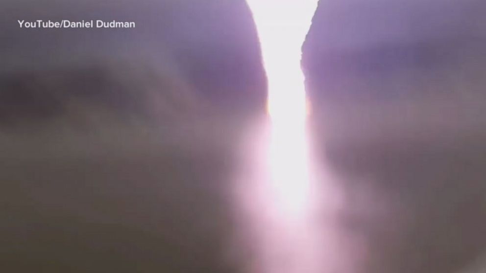 VIDEO: Two men narrowly avoided a lightning strike while filming a thunderstorm in Sydney's Oyster Bay.