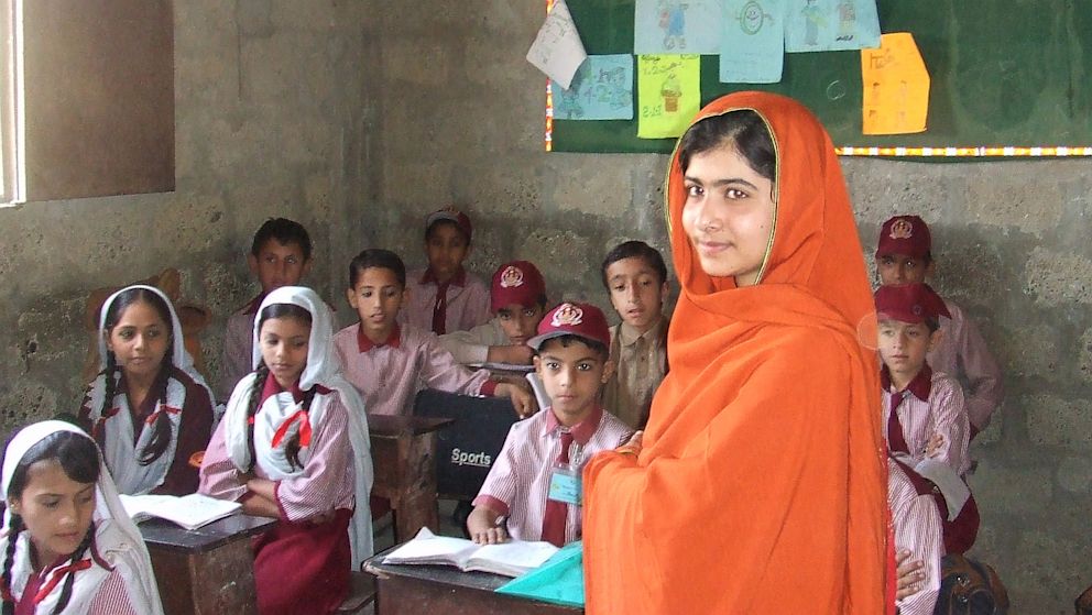 Malala Yousafzai visits a school in Karachi, Pakistan. The school was bombed a few months after her visit.