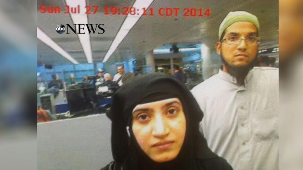 PHOTO: Photo obtained by ABC News shows Tashfeen Malik, center, and Syed Rizwan Farook, right, going through Chicago's O'Hare International Airport on July 27, 2014.