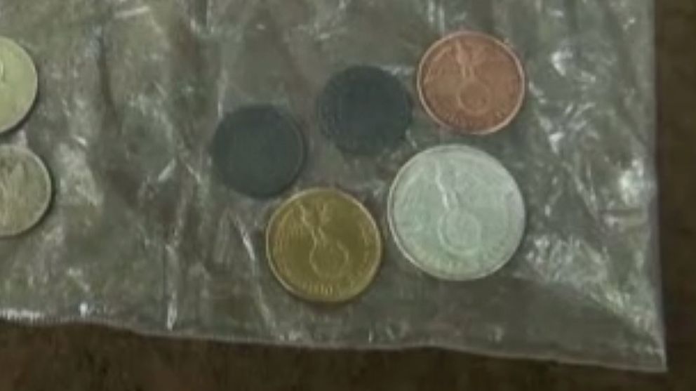 PHOTO: Researchers say that some of the coins found at the site, seen here in a video from Clarin, were believed to be minted in Germany between 1938 and 1944.
