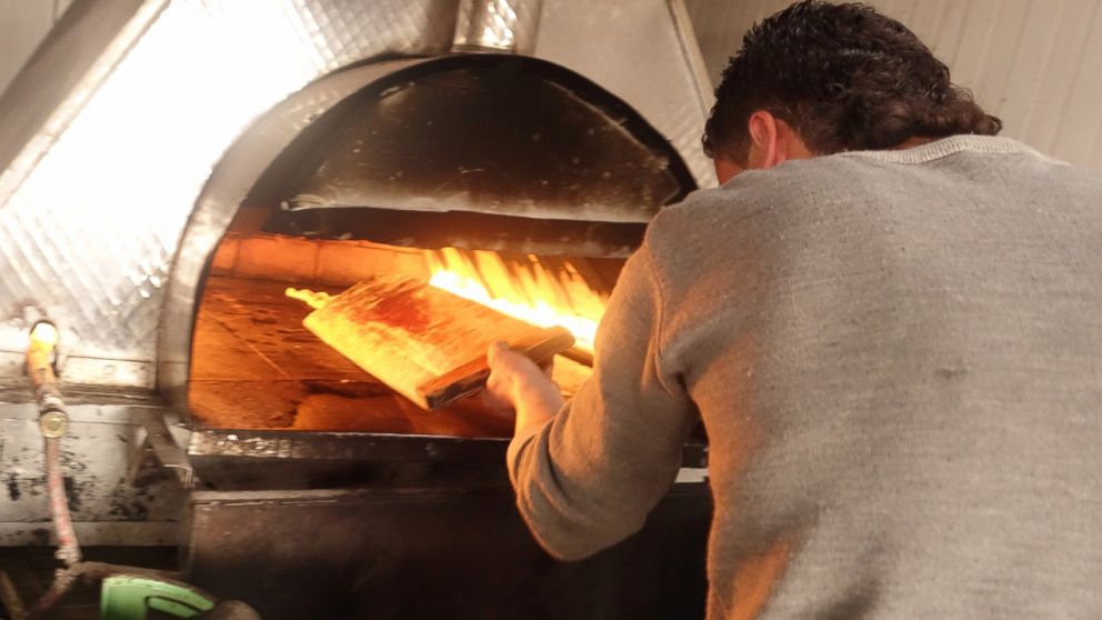 PHOTO: A pizza shop run by Syrian refugees has opened in the Zaatari camp in Jordan.