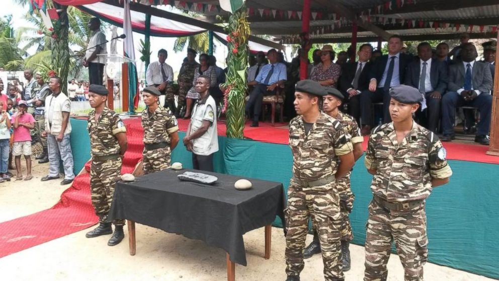 PHOTO: Soldiers guard the silver bar found off the coast of Madagascar.