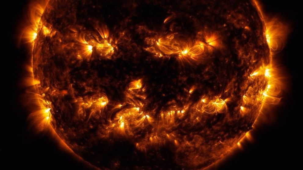 Active regions on the sun combined to look something like a jack-o-lantern’s face on Oct. 8, 2014. The active regions appear brighter because those are areas that emit more light and energy — markers of an intense and complex set of magnetic fields hovering in the sun’s atmosphere, the corona. This image blends together two sets of wavelengths at 171 and 193 Angstroms, typically colorized in gold and yellow, to create a particularly Halloween-like appearance.