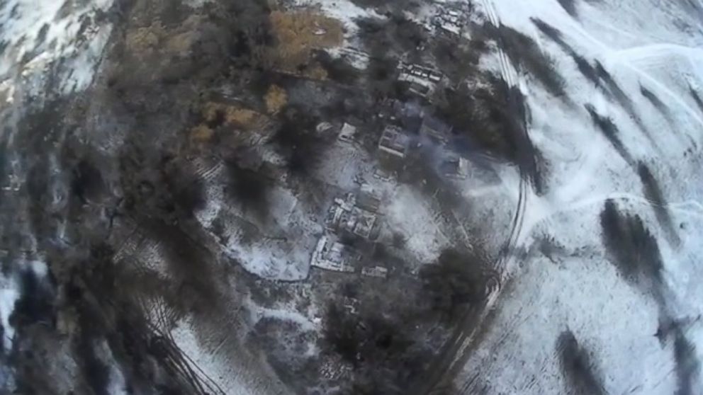 PHOTO: A drone video posted to YouTube on Feb. 18, 2015 shows the aftermath of shelling in Debaltseve, Ukraine, Feb. 18, 2015. The black scorch marks are impact craters. 