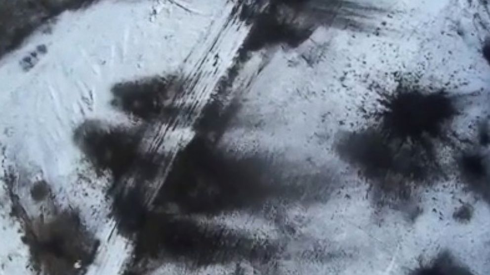 PHOTO: A drone video posted to YouTube on Feb. 18, 2015 shows the aftermath of shelling in Debaltseve, Ukraine, Feb. 18, 2015. The black marks are impact craters. 