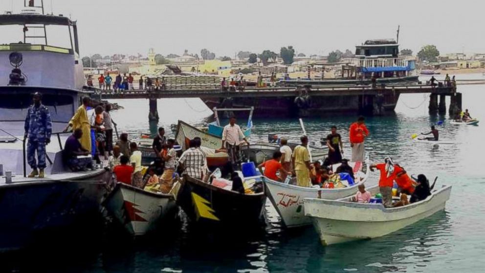 The Djibouti coastguard escorts boats carrying refugees from Yemen into the port of Obock.