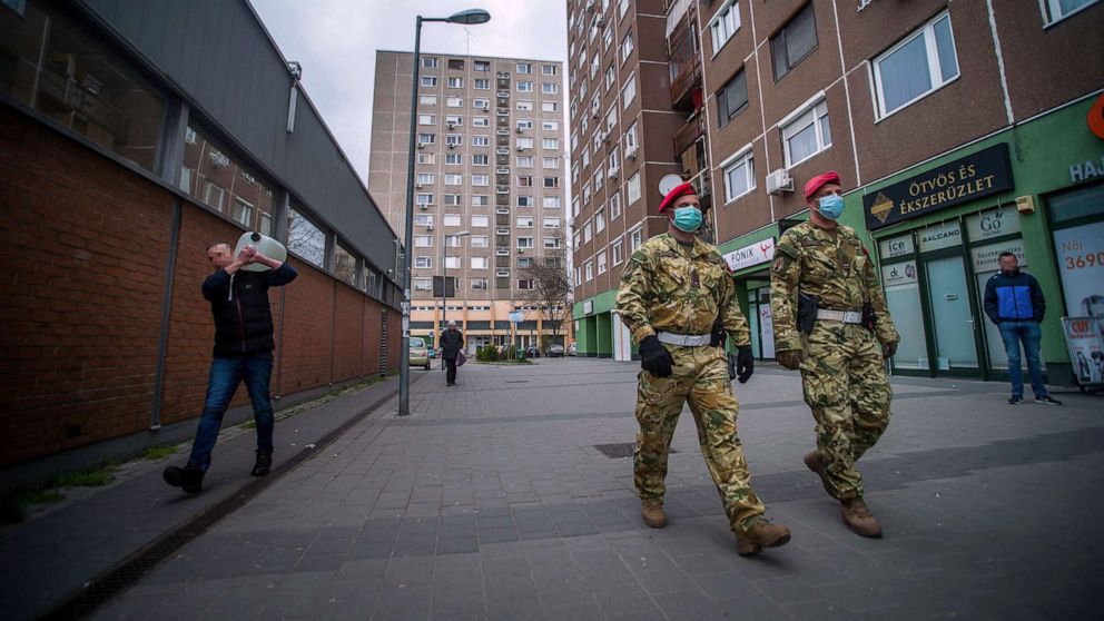 PHOTO: TTwo members of the military police patrol the streets in Budapest, Hungary, March 30, 2020, during a lockdown imposed to fight the coronavirus pandemic.
