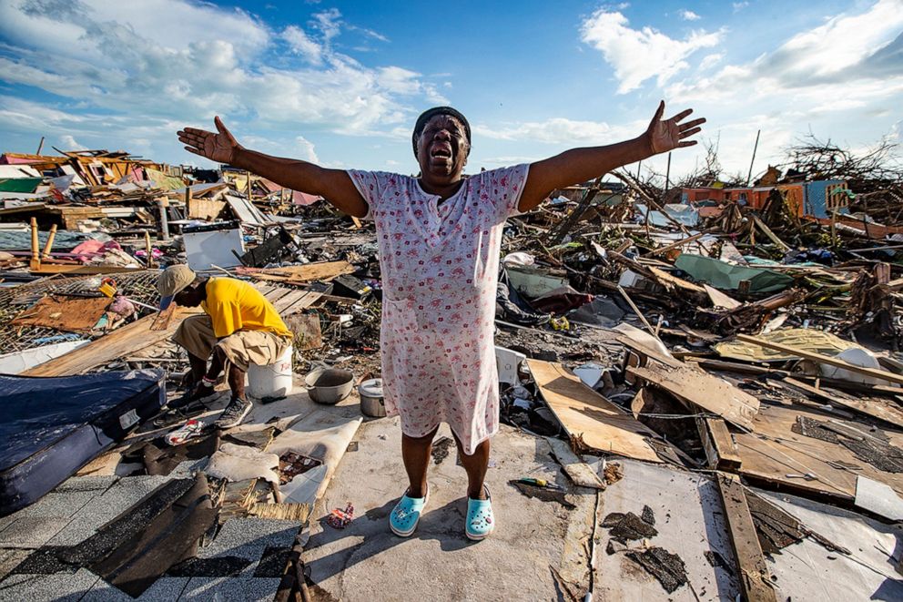 PHOTO: Aliana Alexis, of Haiti, stands on the concrete slab of what is left of her home after destruction from Hurricane Dorian in an area called "The Mud" at Marsh Harbour in Great Abaco Island, Bahamas, Sept. 5, 2019.