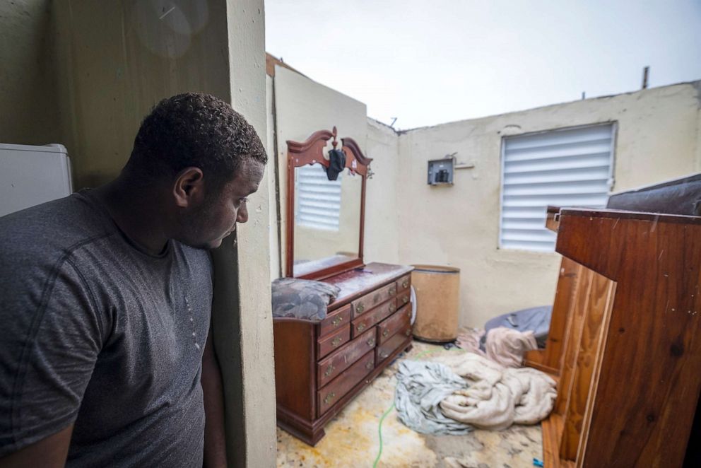 PHOTO: Nelson Cirino inspects his bedroom after the winds of hurricane Fiona tore the roof off his house in Loiza, Puerto Rico, Sept. 18, 2022. 