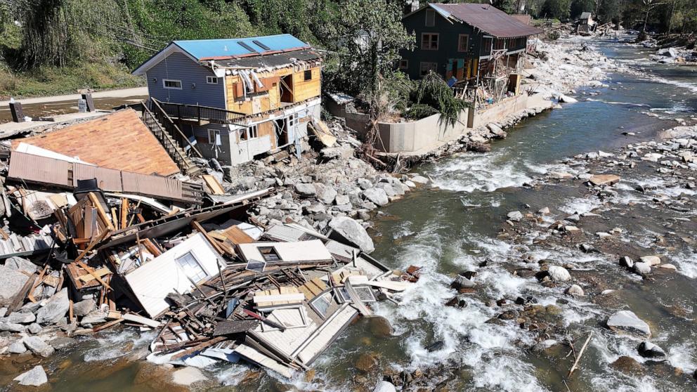 PHOTO: In this Oct. 8, 2024, file photo, an aerial view of destroyed and damaged buildings in the aftermath of Hurricane Helene flooding is shown in Bat Cave, N.C.