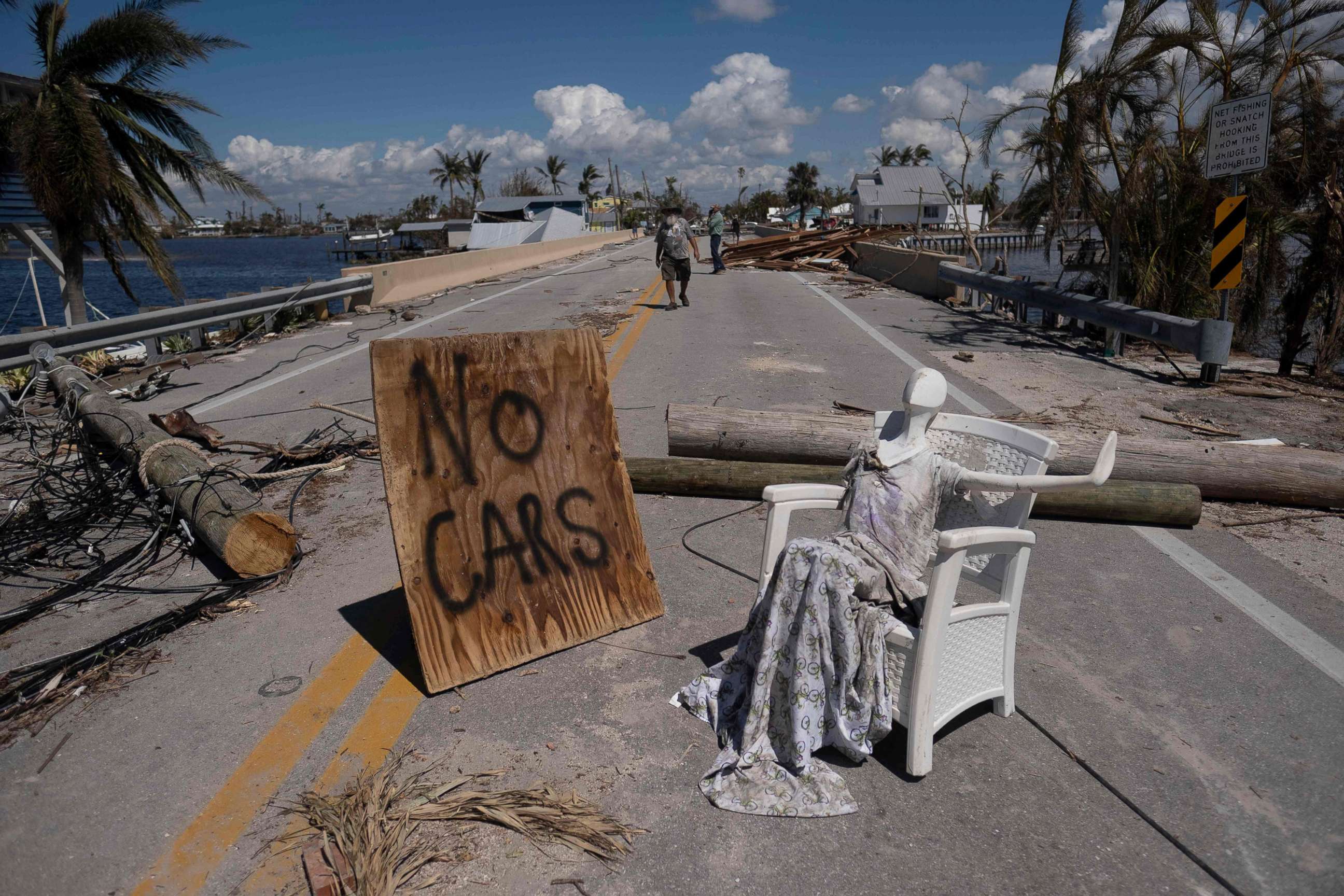 PHOTO: A man walks on a street in the aftermath of Hurricane Ian in Matlacha, Fla., Oct. 1, 2022.