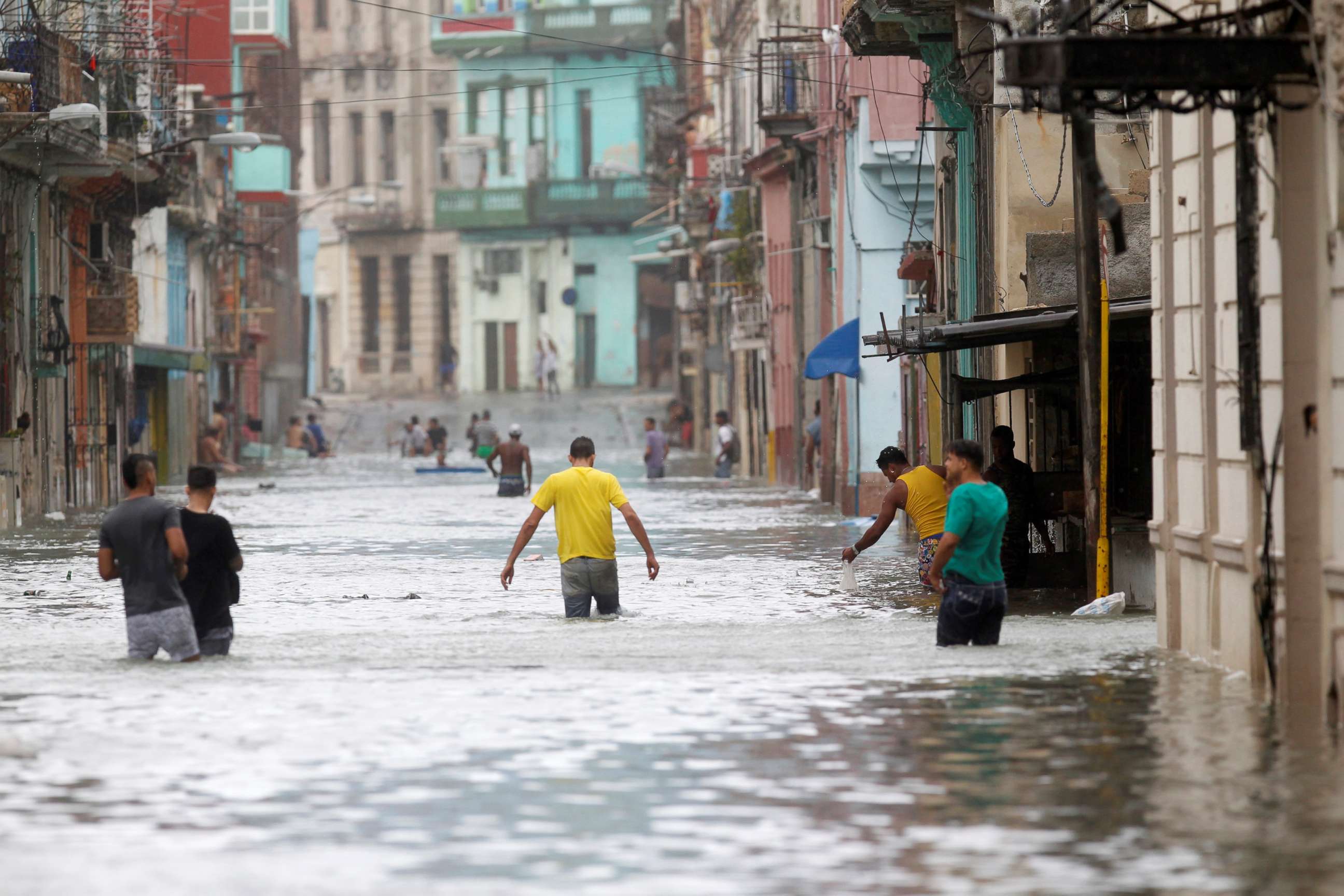 PHOTO: People wade through a flooded street after the passing of Hurricane Irma, in Havana, Cuba, Sept. 10, 2017.