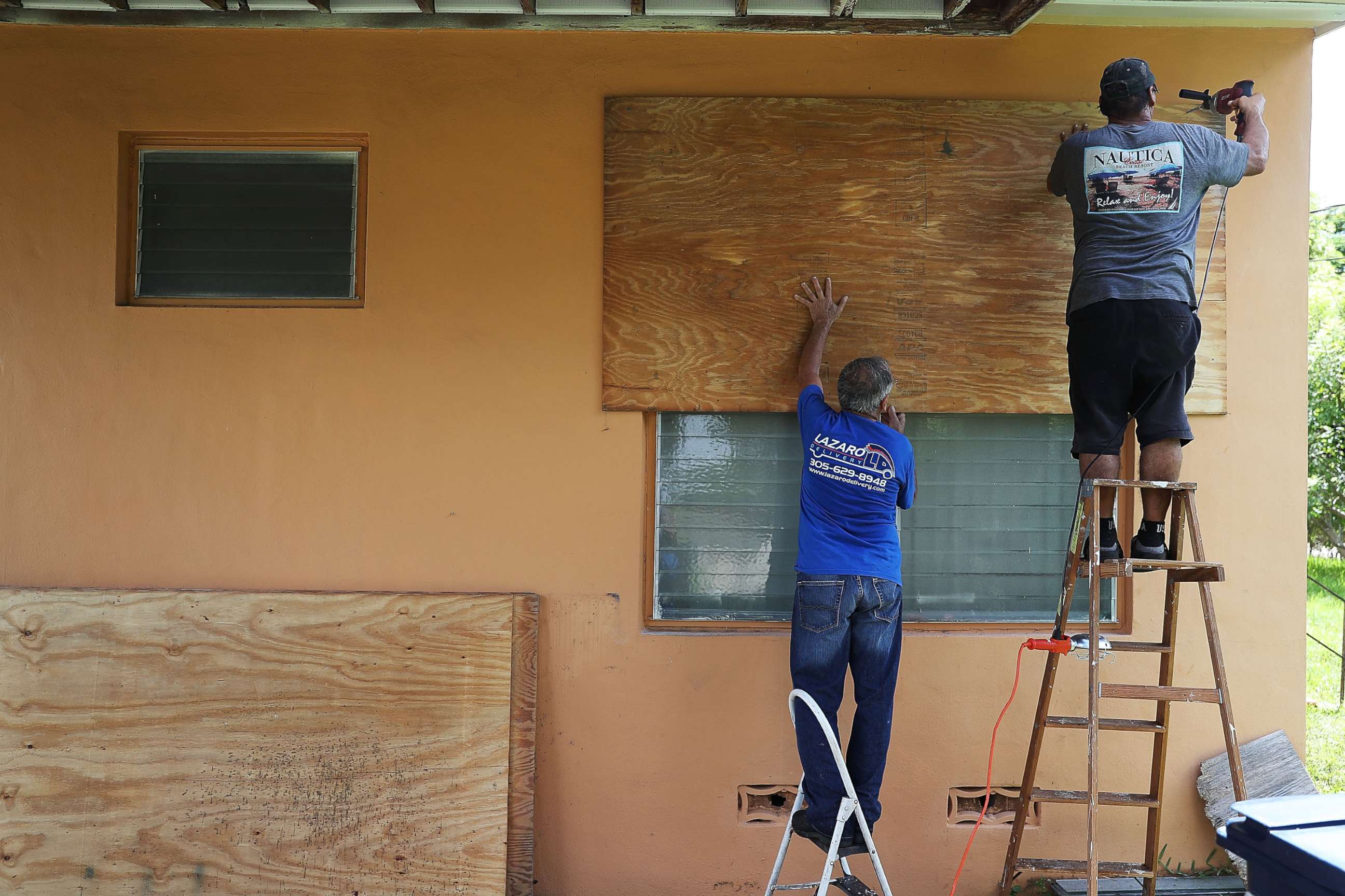 PHOTO: People put up shutters as they prepare a family member's house for Hurricane Irma, Sept. 6, 2017, in Miami.