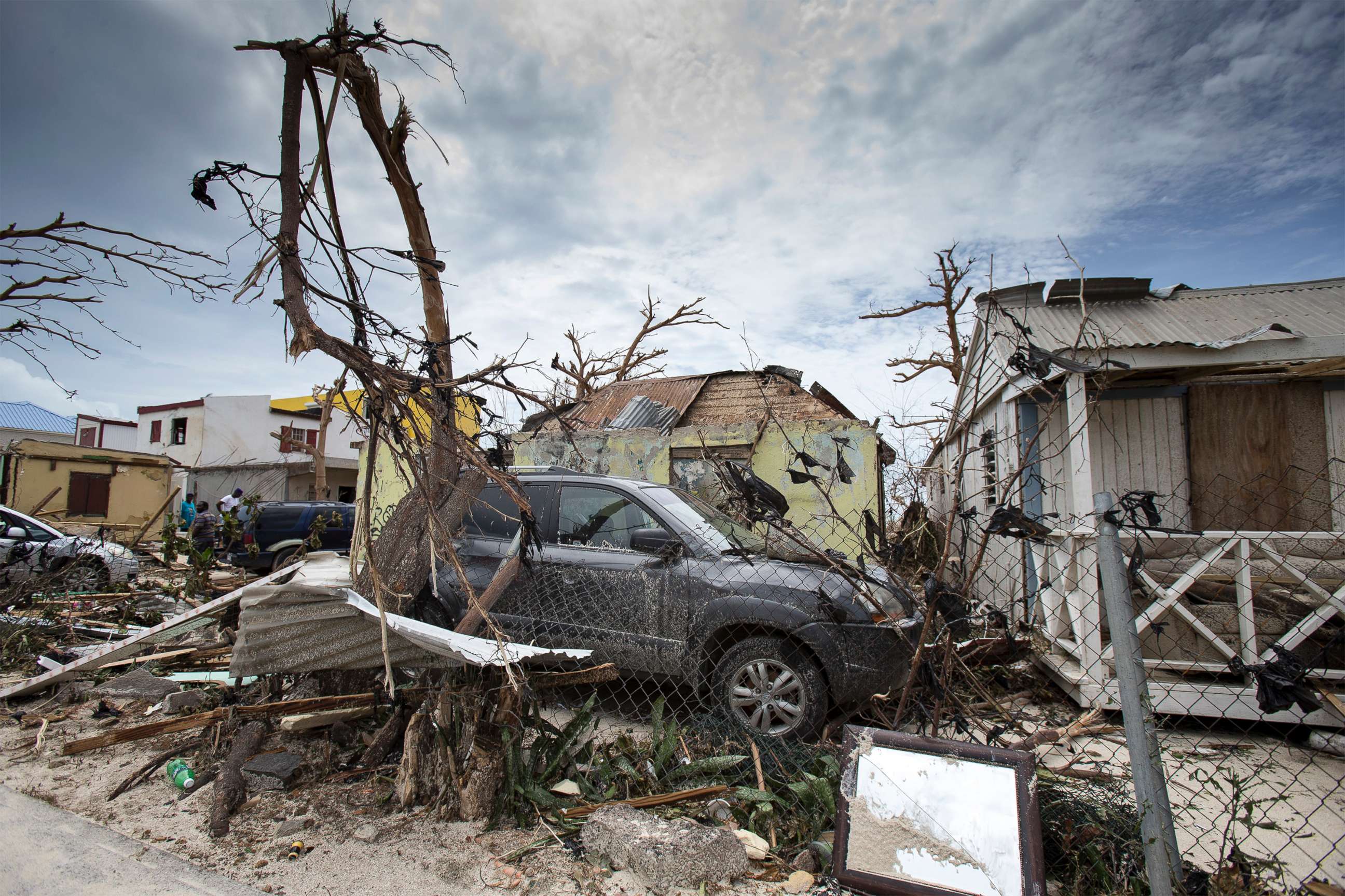 PHOTO: This handout photograph provided courtesy of the Dutch Department of Defense on Sept. 7, 2017, shows houses and cars damaged after the passage of Hurricane Irma on the Dutch Caribbean island of St. Maarten.