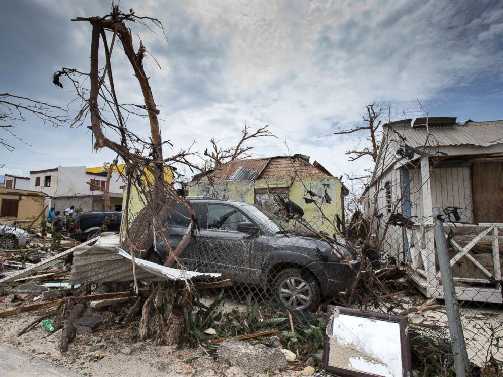 PHOTO: This handout photograph provided courtesy of the Dutch Department of Defense on Sept. 7, 2017, shows houses and cars damaged after the passage of Hurricane Irma on the Dutch Caribbean island of St. Maarten.