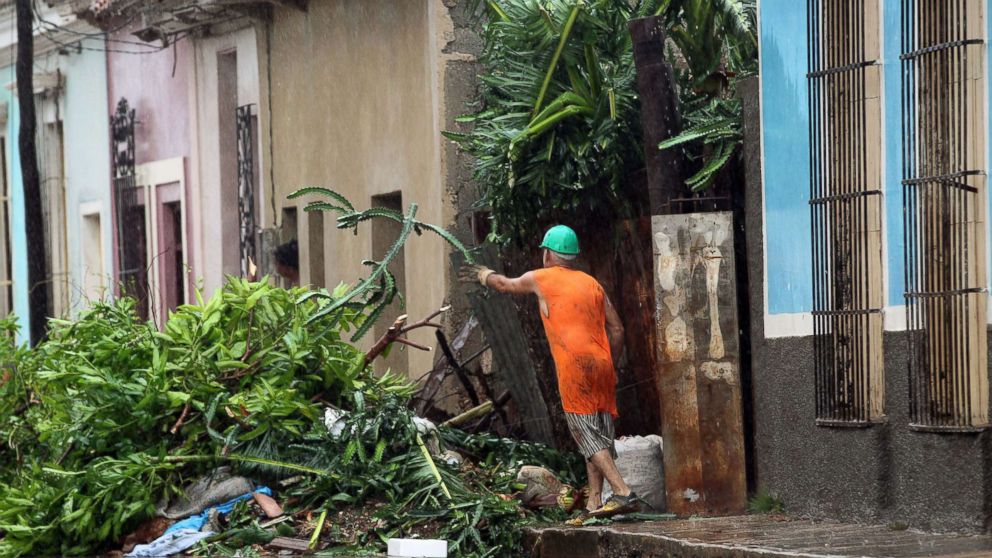 PHOTO: A men cleans the front of his house after the Hurricane Irma, at the central city of Remedios, Cuba, Sept. 9, 2017.