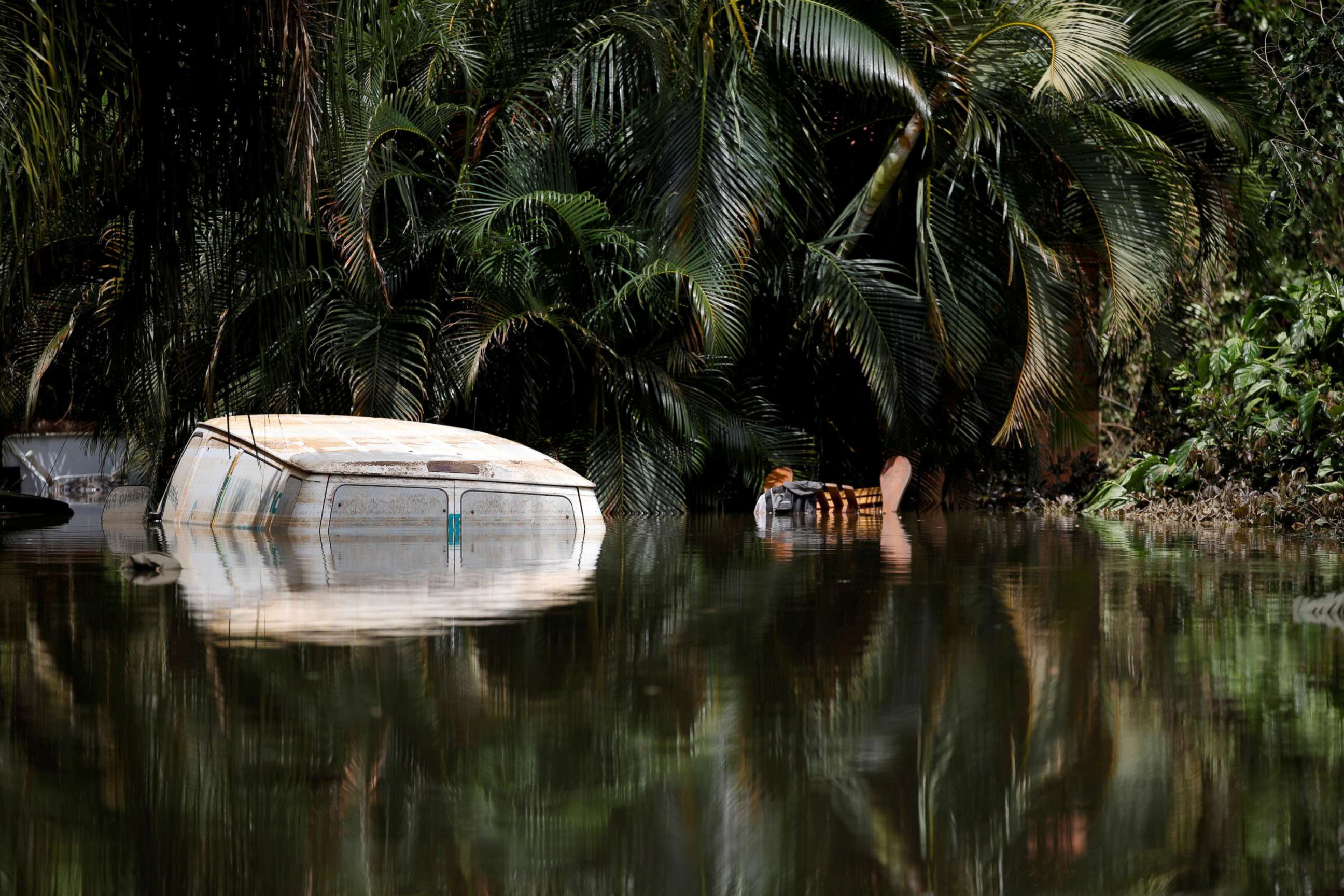 PHOTO: A car submerged in flood waters is seen close to the dam of the Guajataca lake after the area was hit by Hurricane Maria in Guajataca, Puerto Rico, Sept. 23, 2017.