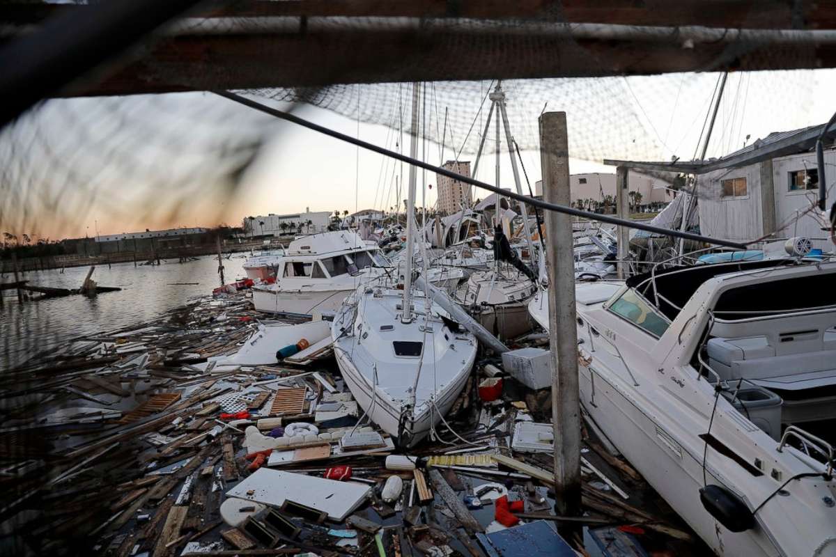 PHOTO: Damaged boats sit among debris in a marina in the aftermath of Hurricane Michael in Panama City, Fla., Oct. 12, 2018. 
