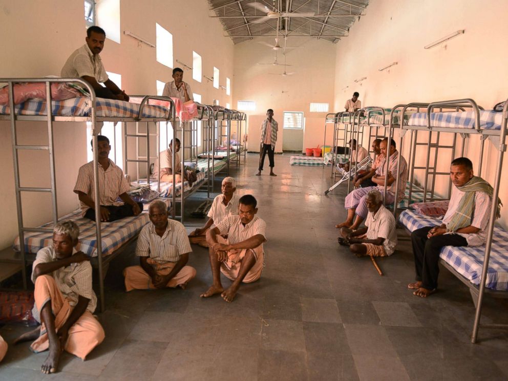 PHOTO: Homeless men were brought to a shelter after begging on the streets sit inside a dormitory in Hyderabad, Nov. 8, 2017.