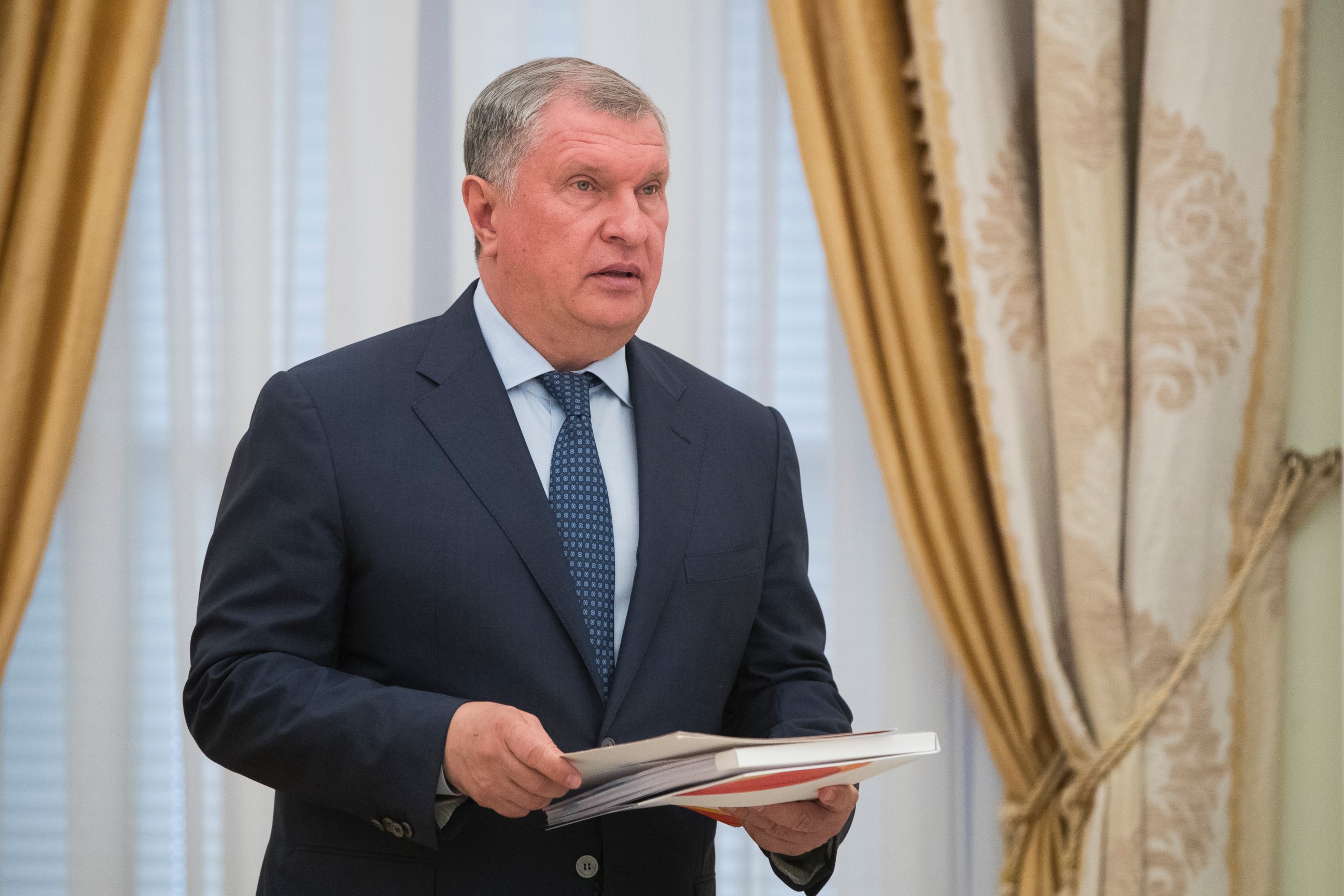CEO of state-controlled Russian oil company Rosneft, Igor Sechin, holds papers prior a meeting with Saudi Deputy Crown Prince and Defense Minister Mohammed bin Salman in Moscow's Kremlin, Russia, Tuesday, May 30, 2017.