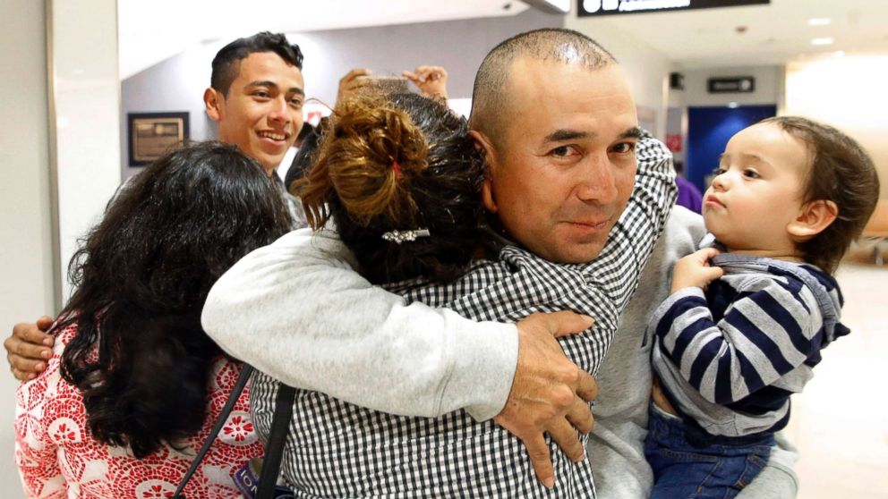 PHOTO: Gabriel Mejia hugs his daughter Wendy, 16, as he holds his son Elias, 1, after her arrival from El Salvador at Baltimore-Washington International Airport on Nov. 12, 2015 in Linthicum, Md.