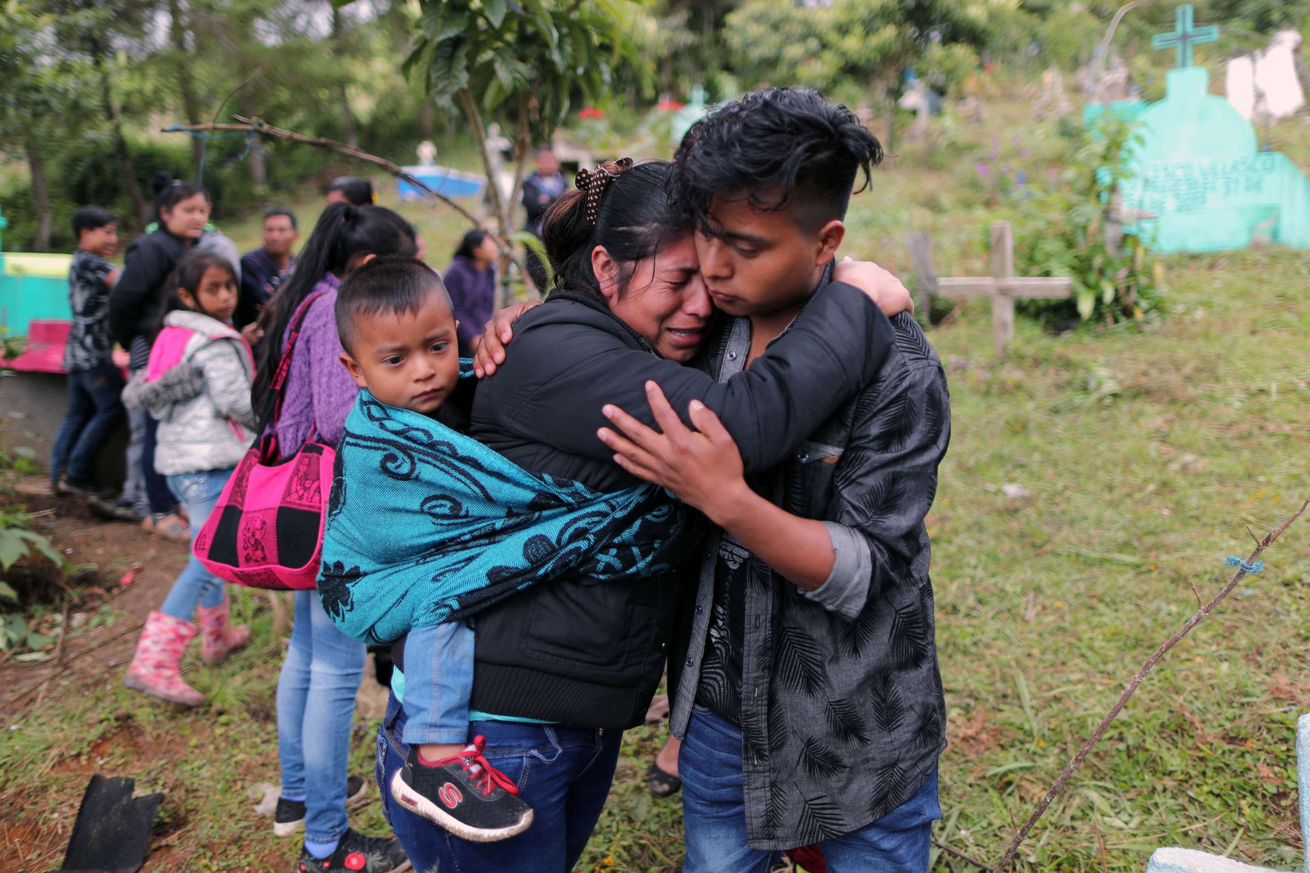 PHOTO: Gaspar Paiz, 25, hugs a friend at the funeral of his twin brother, Misael Paiz, in Aguacate, Huehuetenango, Guatemala, Oct. 29, 2018.
