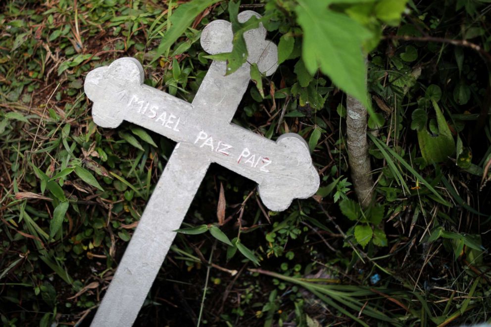 PHOTO: The cross of Misael Paiz, 25, lies on the grass in the cemetery at his funeral in Aguacate, Huehuetenango, Guatemala, Oct. 29, 2018.