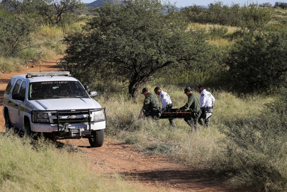 PHOTO: Pima County Sheriff's deputies carry away the body of Guatemalan migrant Misael Paiz, 25, who died from hypothermia in the Sonoran Desert after crossing the U.S.-Mexico border near Sasabe, Ariz., Sept. 10, 2018.