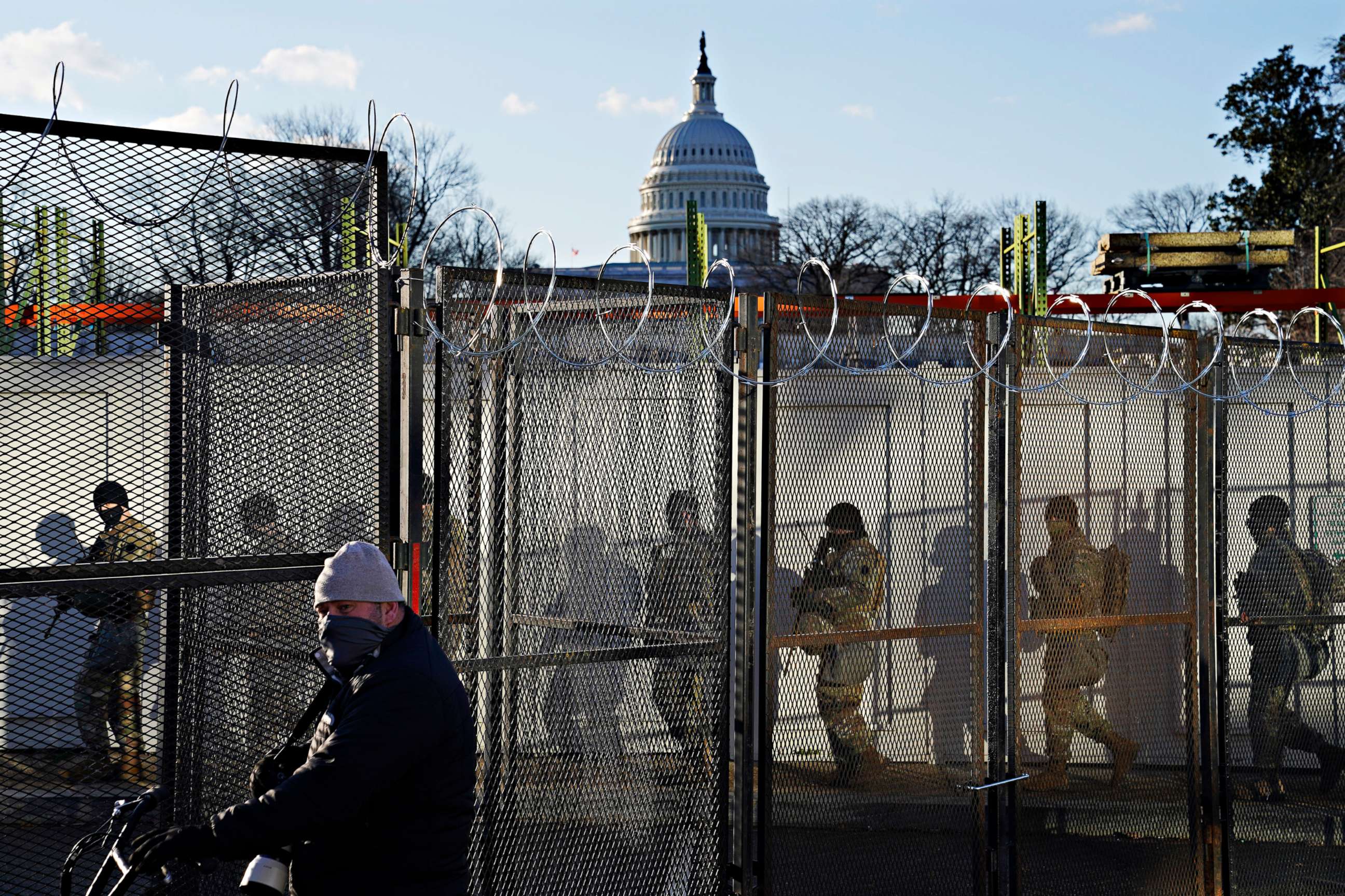 PHOTO: National Guards walk to the Capitol Building as events get underway for President-elect Joe Biden's inauguration ceremony, Jan. 20, 2021, in Washington.